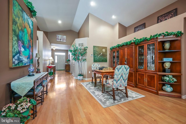 12 Citation Ln, Manalapan, NJ 07726 - dining space featuring high vaulted ceiling, light wood-type flooring, and baseboards