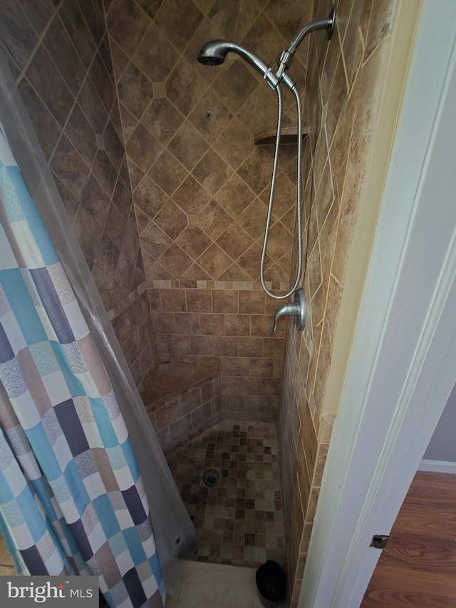 3117 Edgemont St, Philadelphia, PA 19134 - full bathroom with a shower stall and wood finished floors