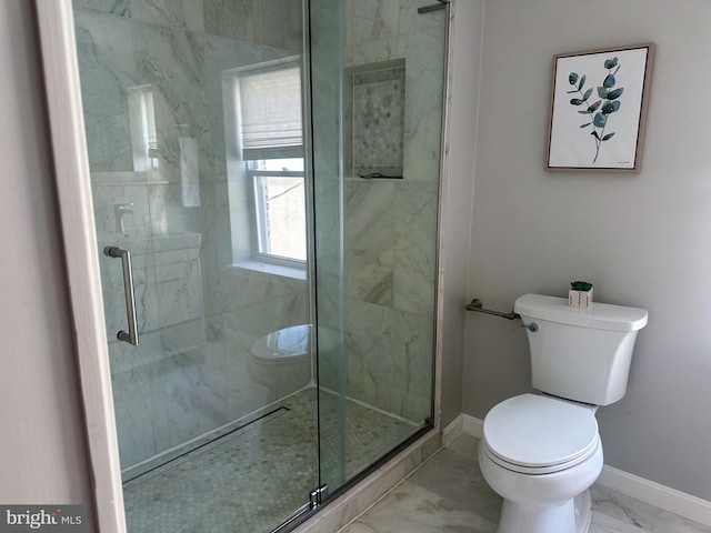 full bathroom with marble finish floor, toilet, baseboards, and a stall shower