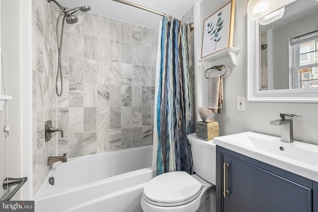 bathroom featuring vanity, toilet, and shower / bath combo