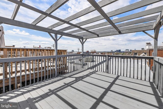 deck featuring a pergola and a view of city