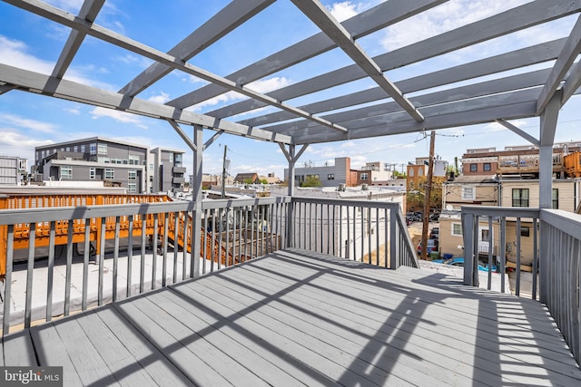 deck with a pergola and a residential view