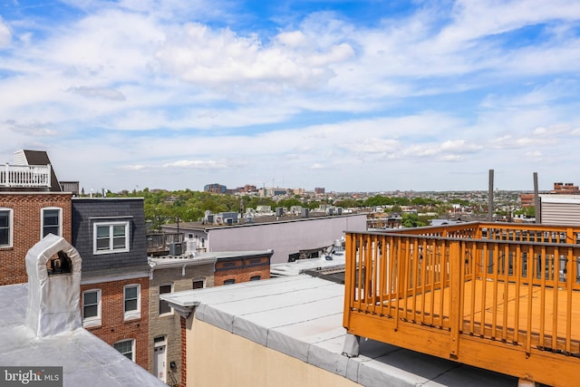 wooden terrace with a city view