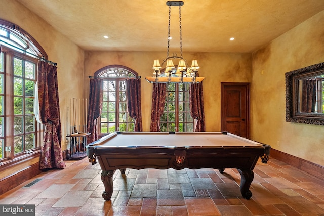 rec room featuring a notable chandelier, recessed lighting, billiards, and stone tile flooring