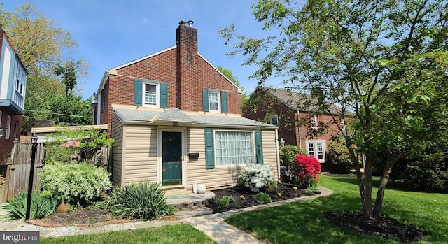 2619 Filbert Ave, Reading, PA 19606 - view of front of house featuring a front yard and a chimney