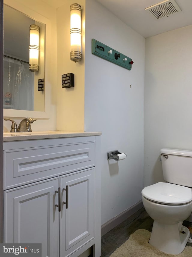 2619 Filbert Ave, Reading, PA 19606 - bathroom featuring vanity, toilet, and baseboards
