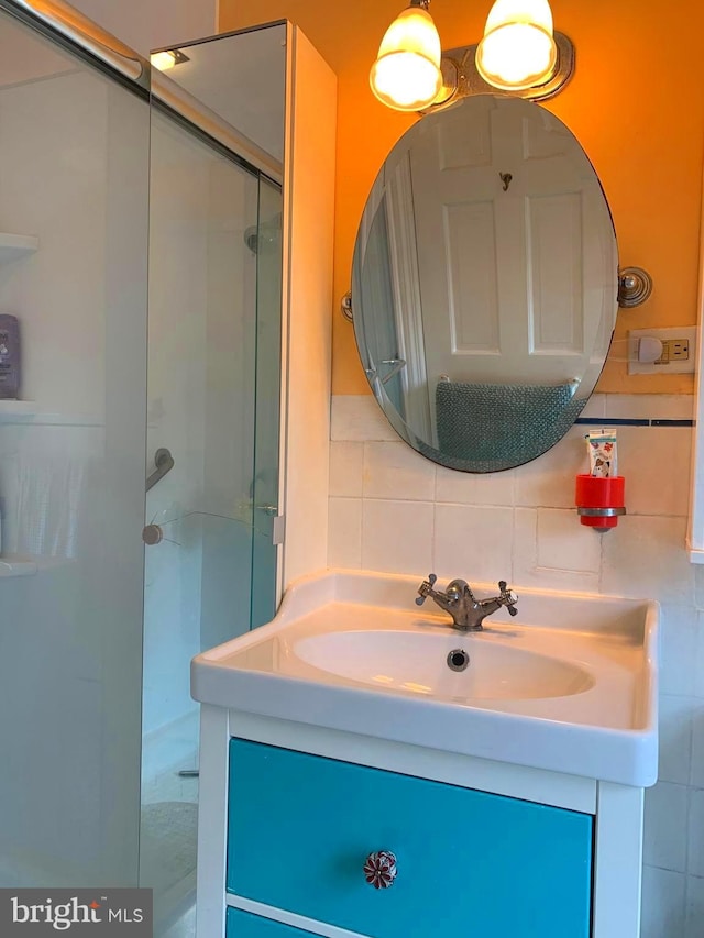 2619 Filbert Ave, Reading, PA 19606 - full bathroom with a shower stall, vanity, and backsplash