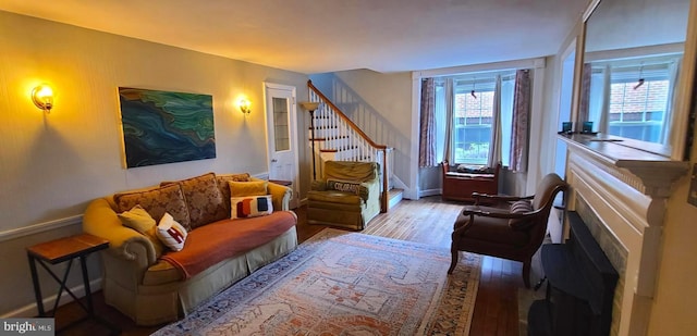 2619 Filbert Ave, Reading, PA 19606 - living area with wood finished floors, stairway, and baseboards