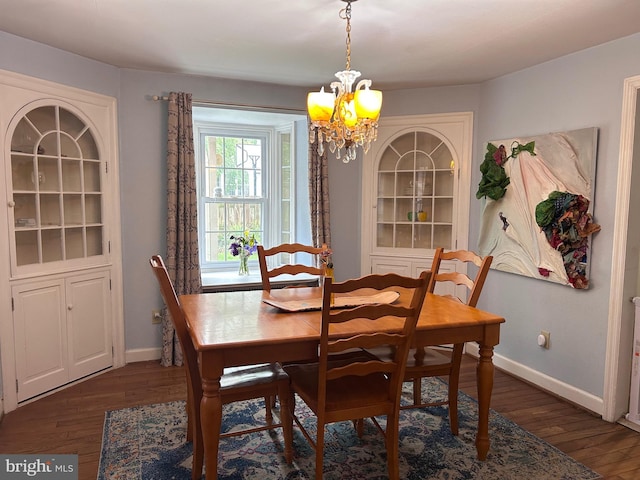 2619 Filbert Ave, Reading, PA 19606 - dining space featuring a chandelier, dark wood finished floors, and baseboards