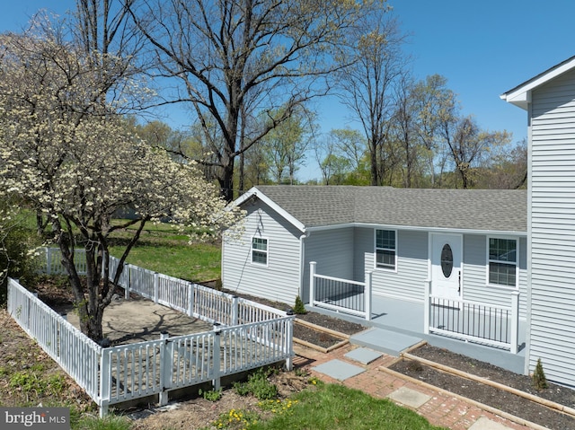 671 Pine Ridge Dr, Front Royal, VA 22630 - view of front of home featuring a shingled roof, fence, and a deck
