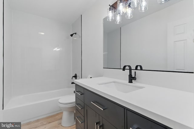671 Pine Ridge Dr, Front Royal, VA 22630 - bathroom with vanity, bathtub / shower combination, toilet, and wood finished floors