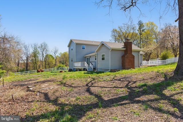 671 Pine Ridge Dr, Front Royal, VA 22630 - back of house featuring fence and a chimney