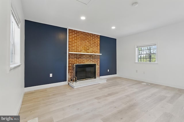 671 Pine Ridge Dr, Front Royal, VA 22630 - unfurnished living room with baseboards, a brick fireplace, recessed lighting, and wood finished floors