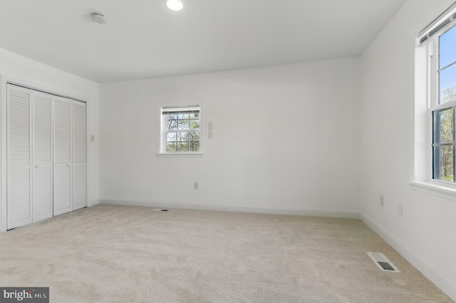 671 Pine Ridge Dr, Front Royal, VA 22630 - unfurnished bedroom featuring visible vents, multiple windows, and light carpet