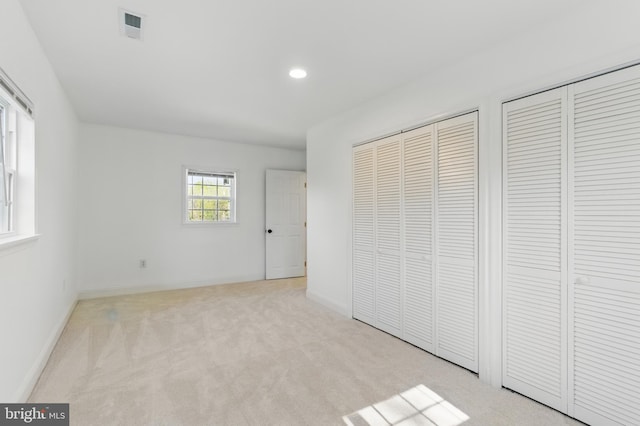 671 Pine Ridge Dr, Front Royal, VA 22630 - unfurnished bedroom featuring carpet floors, two closets, recessed lighting, baseboards, and visible vents