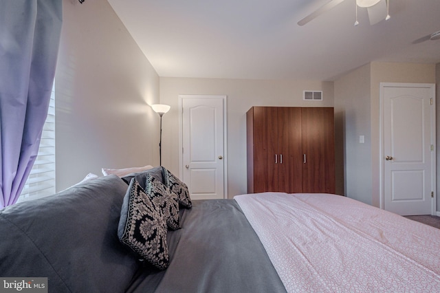 bedroom featuring ceiling fan and visible vents