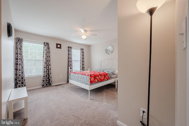 bedroom featuring baseboards, carpet, and ceiling fan