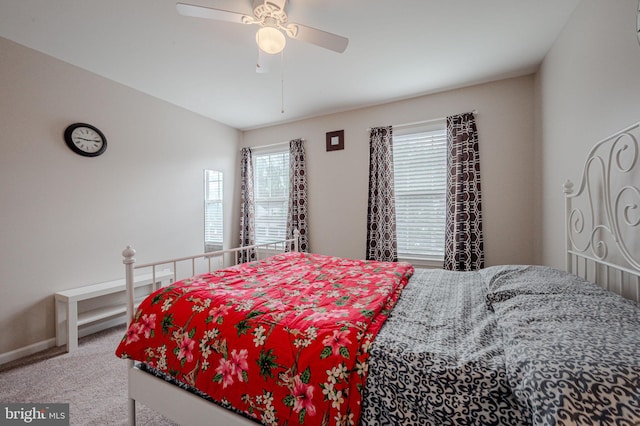 bedroom featuring carpet floors, a ceiling fan, and baseboards