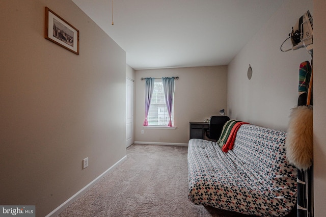 sitting room with carpet flooring and baseboards
