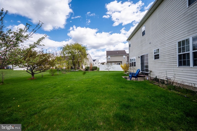 view of yard featuring a patio and fence