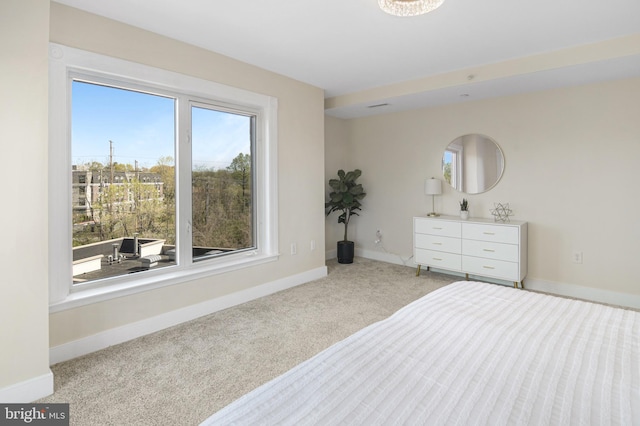 carpeted bedroom with baseboards