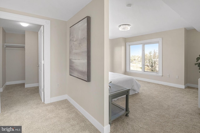 carpeted bedroom with baseboards