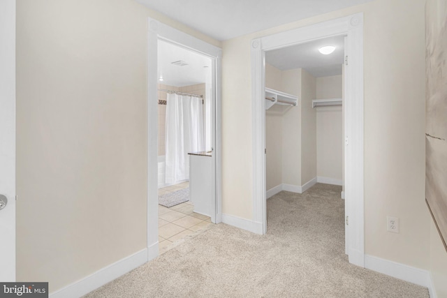 interior space featuring carpet and tile patterned flooring