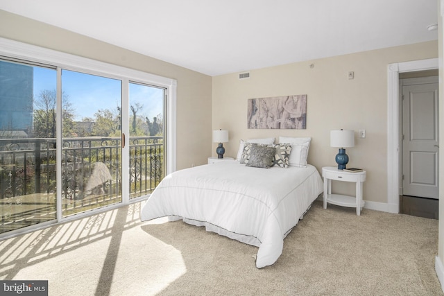 bedroom featuring carpet, visible vents, baseboards, and access to exterior