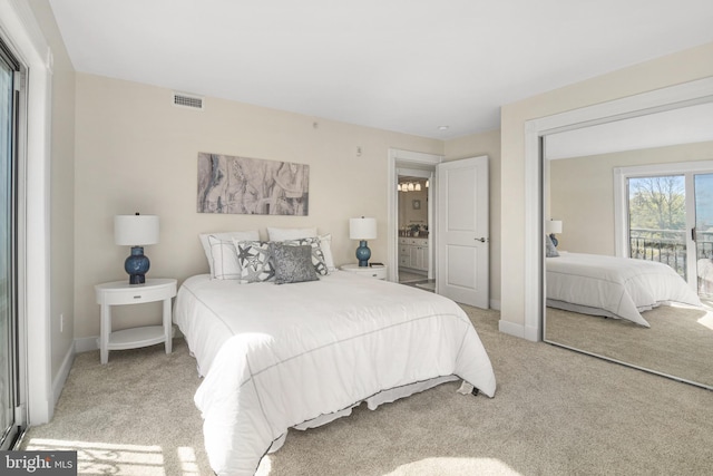 bedroom featuring carpet floors, visible vents, and baseboards