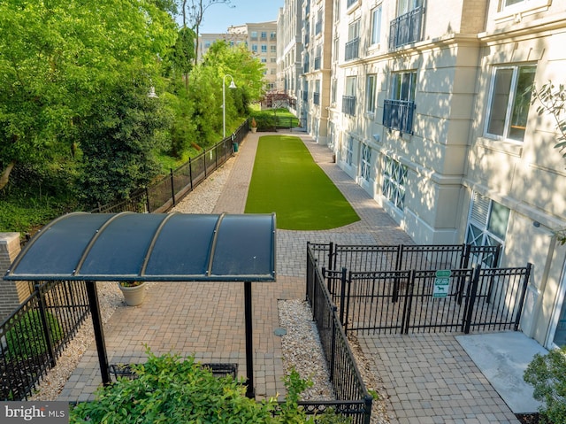 view of home's community with fence