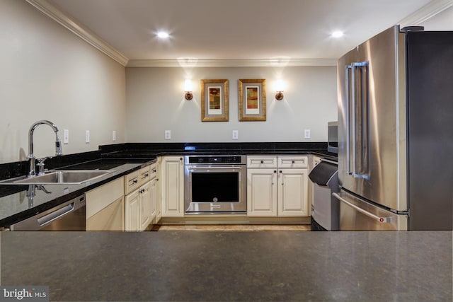 kitchen with stainless steel appliances, a sink, and crown molding