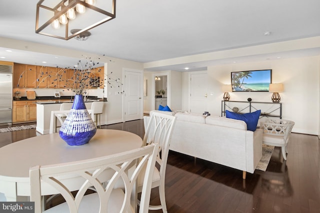 dining area featuring baseboards, dark wood-style flooring, and recessed lighting