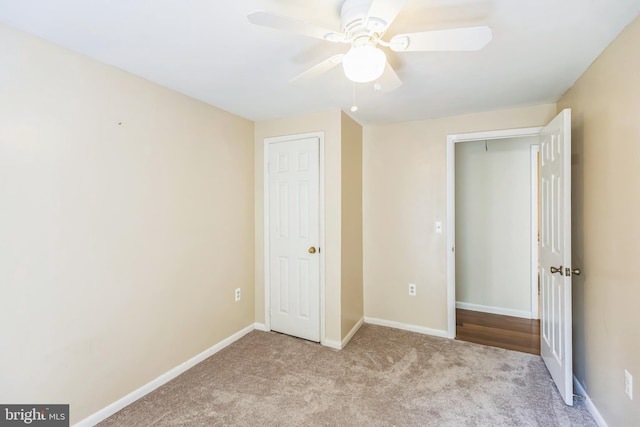9427 Candleberry Ct, Burke, VA 22015 - unfurnished bedroom featuring baseboards, ceiling fan, and carpet
