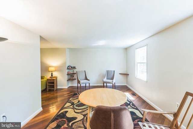 9427 Candleberry Ct, Burke, VA 22015 - living area with wood finished floors, visible vents, and baseboards