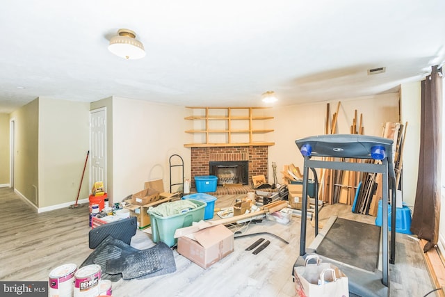 9427 Candleberry Ct, Burke, VA 22015 - below grade area with a fireplace, wood finished floors, visible vents, and baseboards