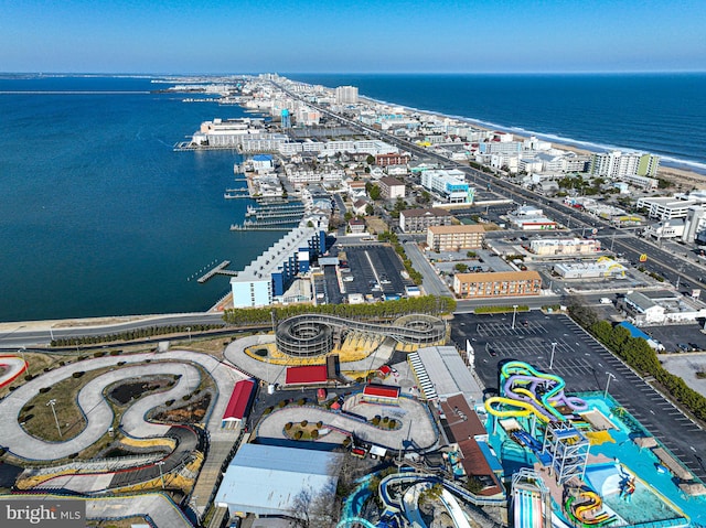 birds eye view of property with a view of city and a water view