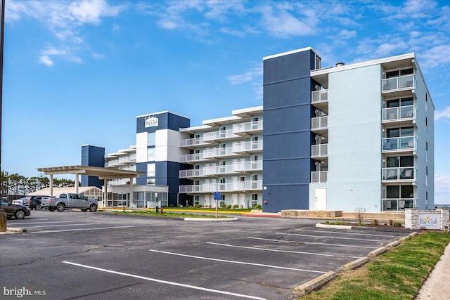 view of property with uncovered parking