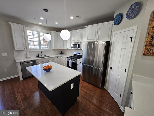 1317 Lowman St, Baltimore, MD 21230 - kitchen featuring visible vents, stainless steel appliances, white cabinets, and a sink