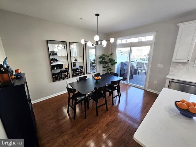 1317 Lowman St, Baltimore, MD 21230 - dining space with baseboards, an inviting chandelier, and dark wood-type flooring