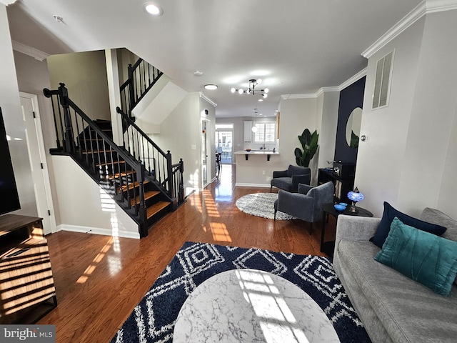 1317 Lowman St, Baltimore, MD 21230 - living room featuring baseboards, visible vents, wood finished floors, and stairs