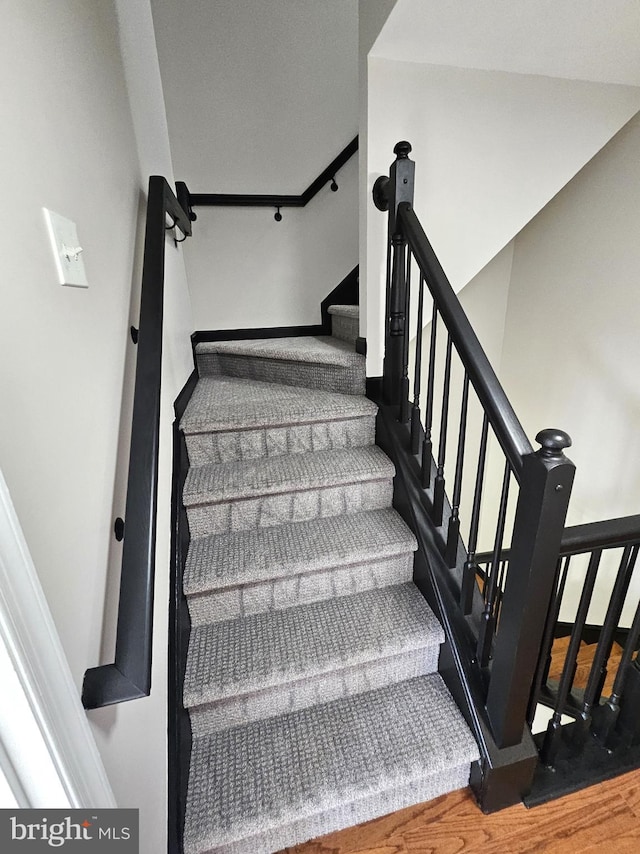1317 Lowman St, Baltimore, MD 21230 - staircase featuring wood finished floors