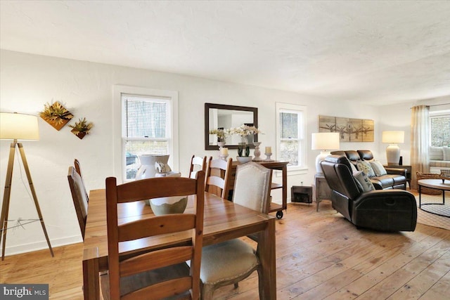 dining room with light wood finished floors