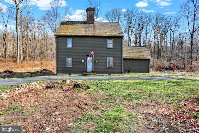 exterior space featuring a chimney and entry steps