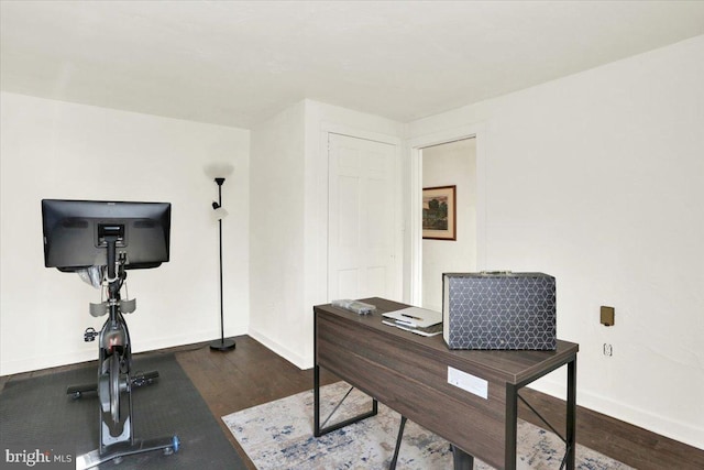 office space featuring wood finished floors and baseboards