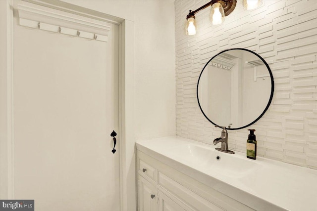 bathroom with vanity and decorative backsplash