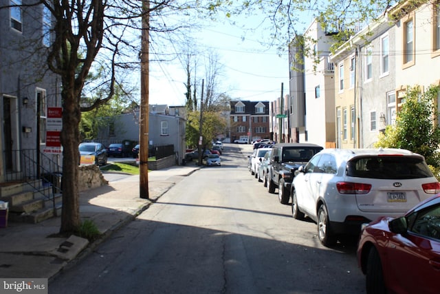 view of street with a residential view and sidewalks