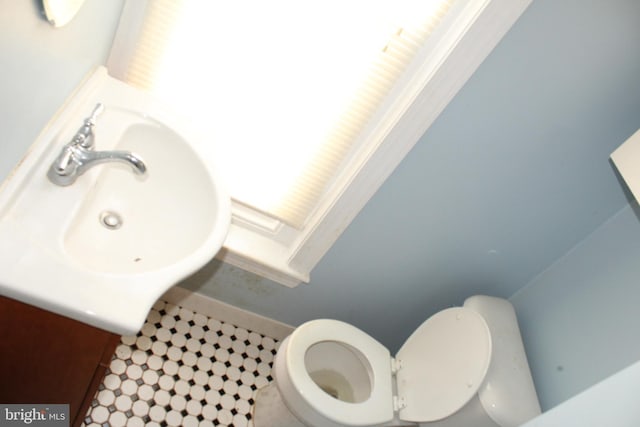 bathroom featuring vanity and toilet