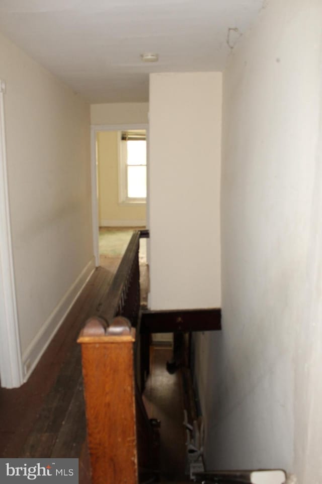 stairs with wood finished floors