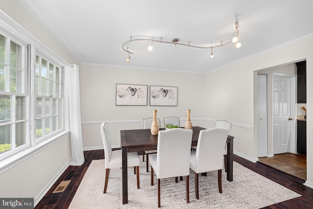 1517 Snughill Ct, Vienna, VA 22182 - dining space featuring healthy amount of natural light, dark wood-type flooring, ornamental molding, and baseboards