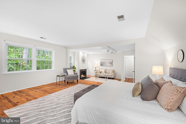 1517 Snughill Ct, Vienna, VA 22182 - bedroom with wood finished floors, a fireplace with flush hearth, and baseboards